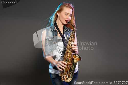 Image of beautiful blonde as saxophonist woman 