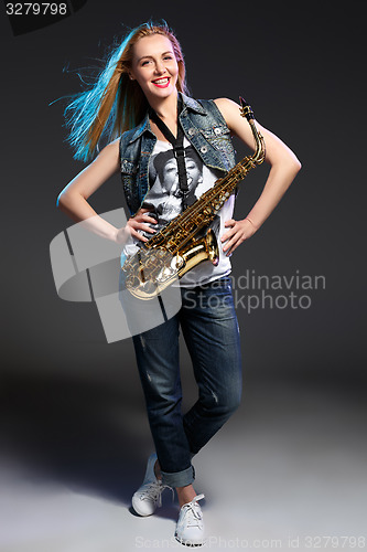 Image of beautiful blonde as saxophonist woman 