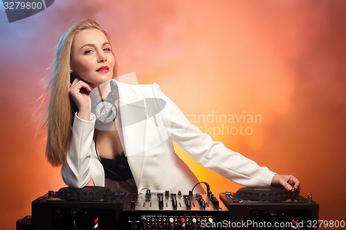 Image of Beautiful blonde DJ girl on decks - the party,