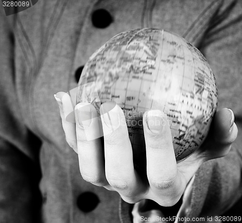 Image of Globe in a girl\'s hands