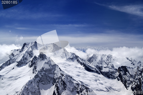 Image of Snowy mountains in clouds