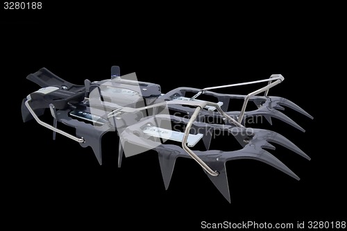 Image of Pair of ice crampon on black background 