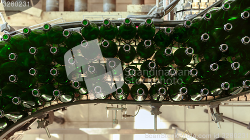 Image of Many bottles on conveyor belt