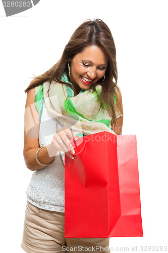 Image of Fashionable Woman Looking Inside a Shopping Bag