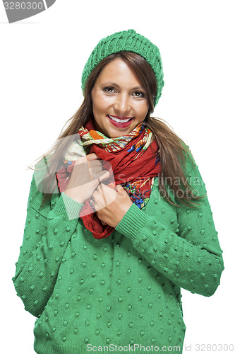 Image of Cute sexy young woman in a green winter outfit