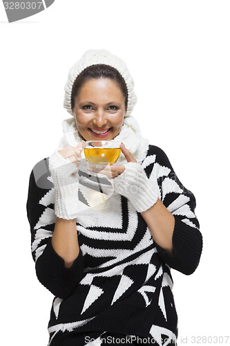 Image of Elegant woman in a black and white winter outfit