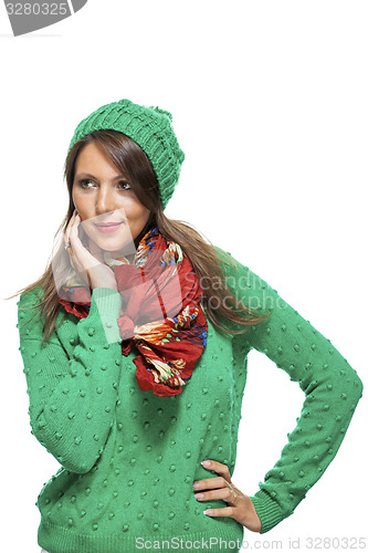 Image of Cute sexy young woman in a green winter outfit