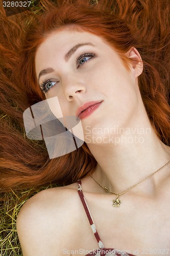 Image of Happy Woman Lying on Grassy Ground