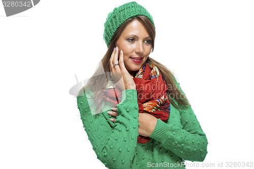 Image of Cute sexy young woman in a green winter outfit