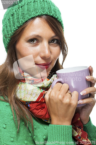 Image of Pretty Woman in Winter Fashion Drinking Coffee