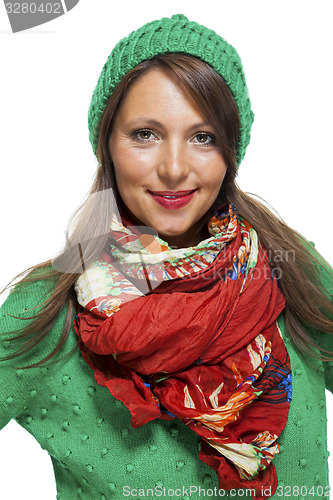 Image of Cute sexy young woman in a green winter outfit