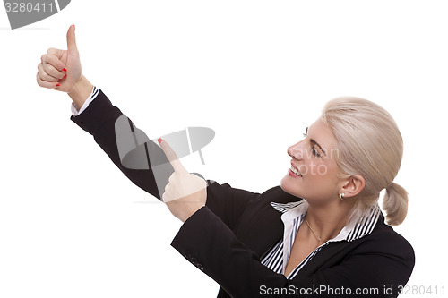 Image of Businesswoman Pointing Up While Looking at Camera