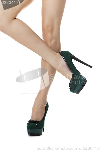 Image of Sexy Woman Legs in Green High Heel Shoes