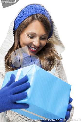 Image of Young woman holding a blue gift