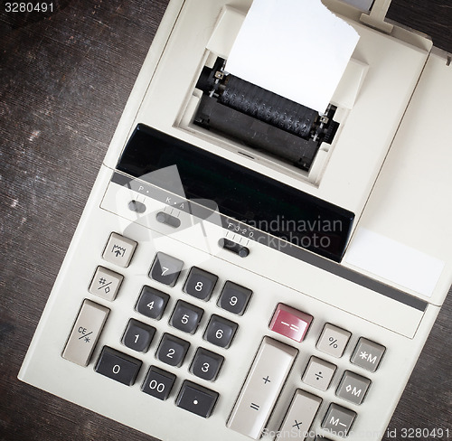 Image of Closeup of an old dirty calculator 