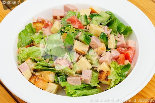 Image of Salad with cheese, ham and fresh vegetables