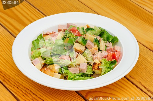 Image of Salad with cheese, ham and fresh vegetables