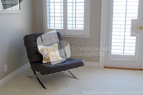 Image of leather seat in empty room