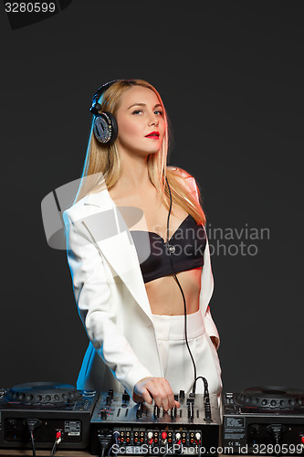 Image of Beautiful blonde DJ girl on decks - the party,