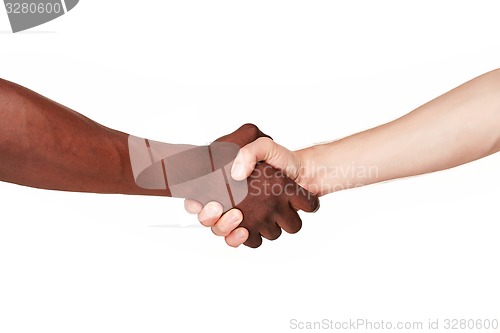 Image of Black and white human hands in a modern handshake 