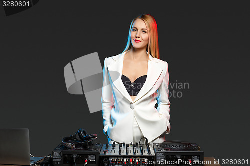 Image of Beautiful blonde DJ girl on decks - the party,