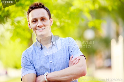 Image of Young man outdoors portrait 