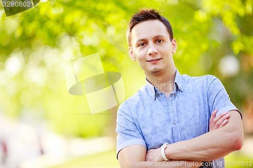 Image of Young man outdoors portrait 