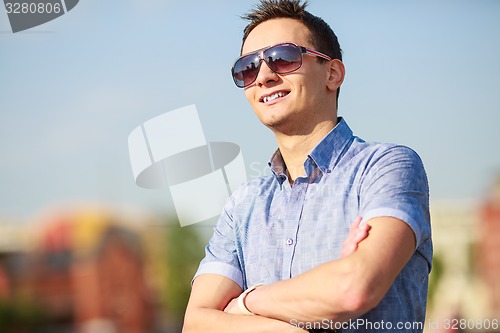 Image of portrait of a trendy young man in the city