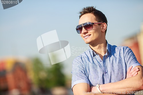 Image of portrait of a trendy young man in the city