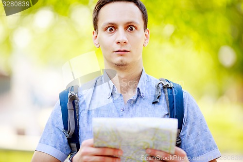 Image of Tourist with map. 