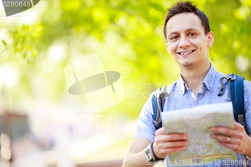Image of Tourist with map. 
