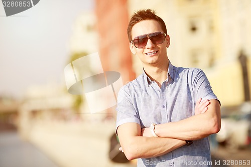 Image of Portrait of a handsome young man with sunglasses