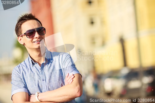 Image of Portrait of a handsome young man with sunglasses