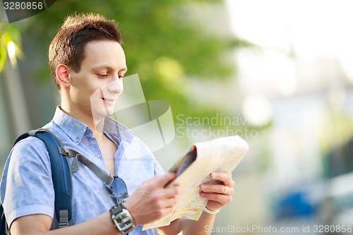 Image of Young man with map