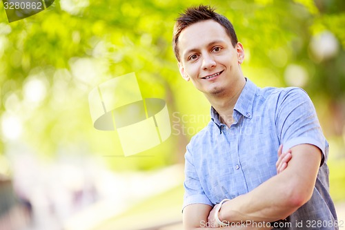 Image of Young man outdoors portrait 