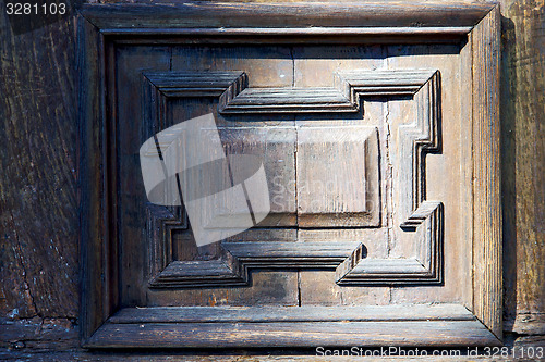 Image of   blur   abstract   rusty brass brown knocker in a  door curch  