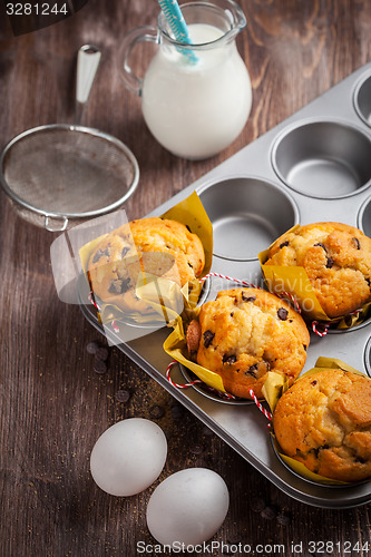 Image of Homemade muffins with baking ingredients