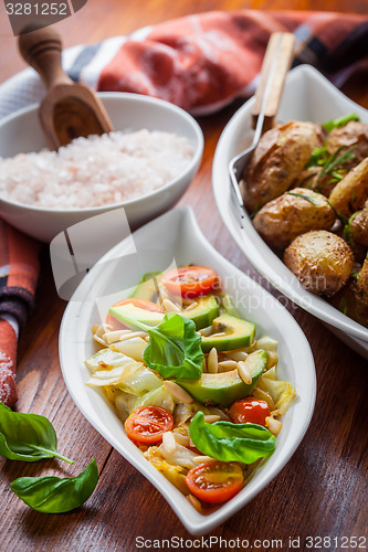 Image of Cabbage salad with avocado and oven potatoes 