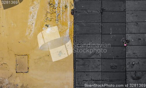 Image of Scraped wall and a wooden door