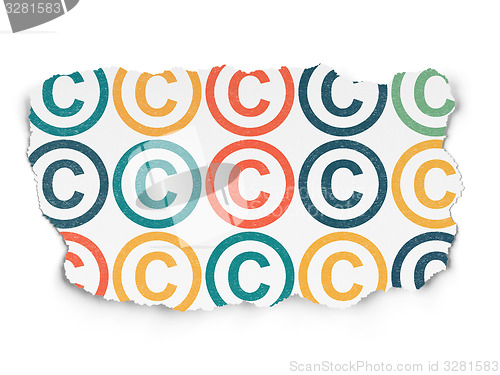 Image of Law concept: Copyright icons on Torn Paper background