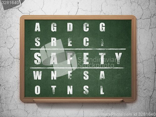 Image of Safety concept: word Safety in solving Crossword Puzzle