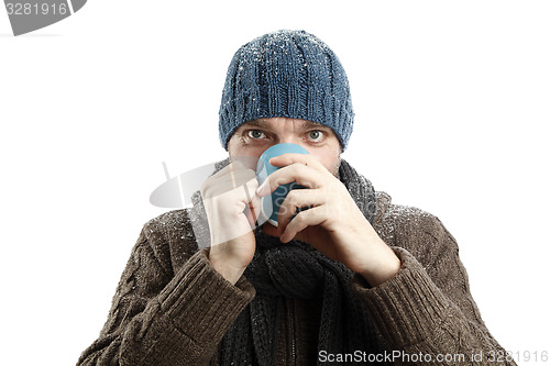 Image of Attractive man with a cup of tea in his hands