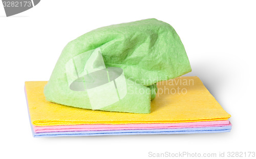 Image of Multicolored cleaning cloths crumpled on top
