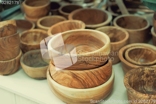 Image of Original dishes made of natural wood.