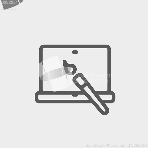 Image of Laptop and pen an editors tools thin line icon