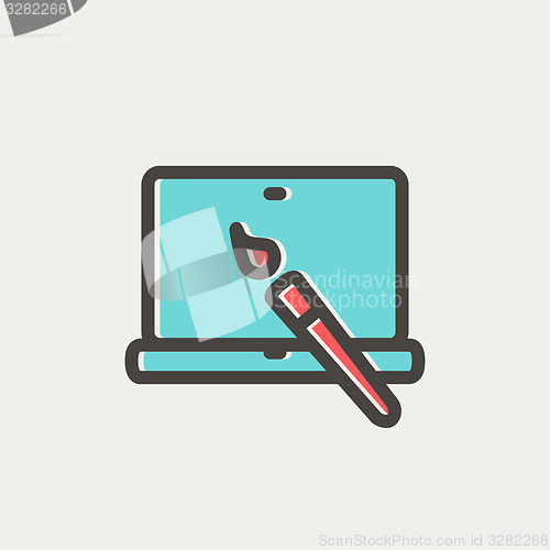 Image of Laptop and pen an editors tools thin line icon