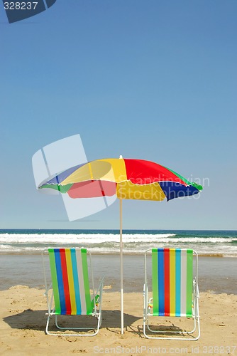 Image of Beach chairs and umbrella
