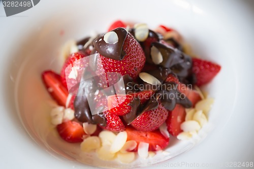 Image of fresh strawberries dipped in dark chocolate