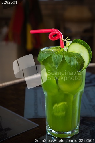 Image of tropical green cocktail with lemon and fresh mint