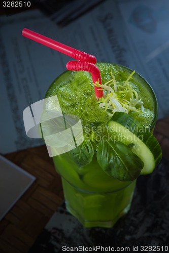 Image of tropical green cocktail with lemon and fresh mint